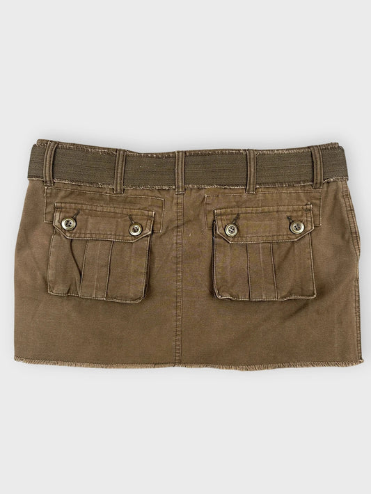 Back view of brown mini skirt featuring unique belt detail and two back pockets.