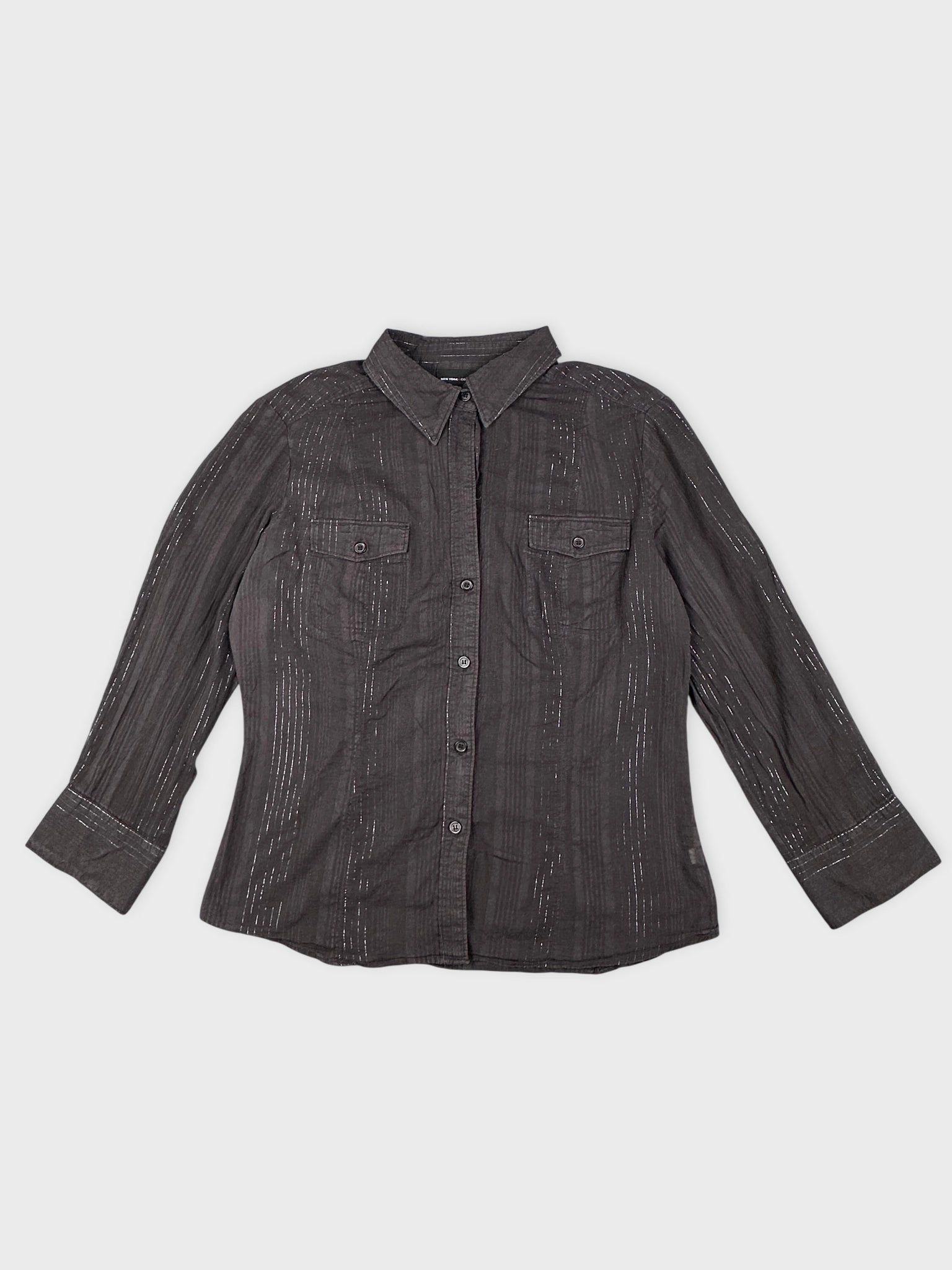 Front view of a brown button-up shirt featuring a subtle striped pattern.