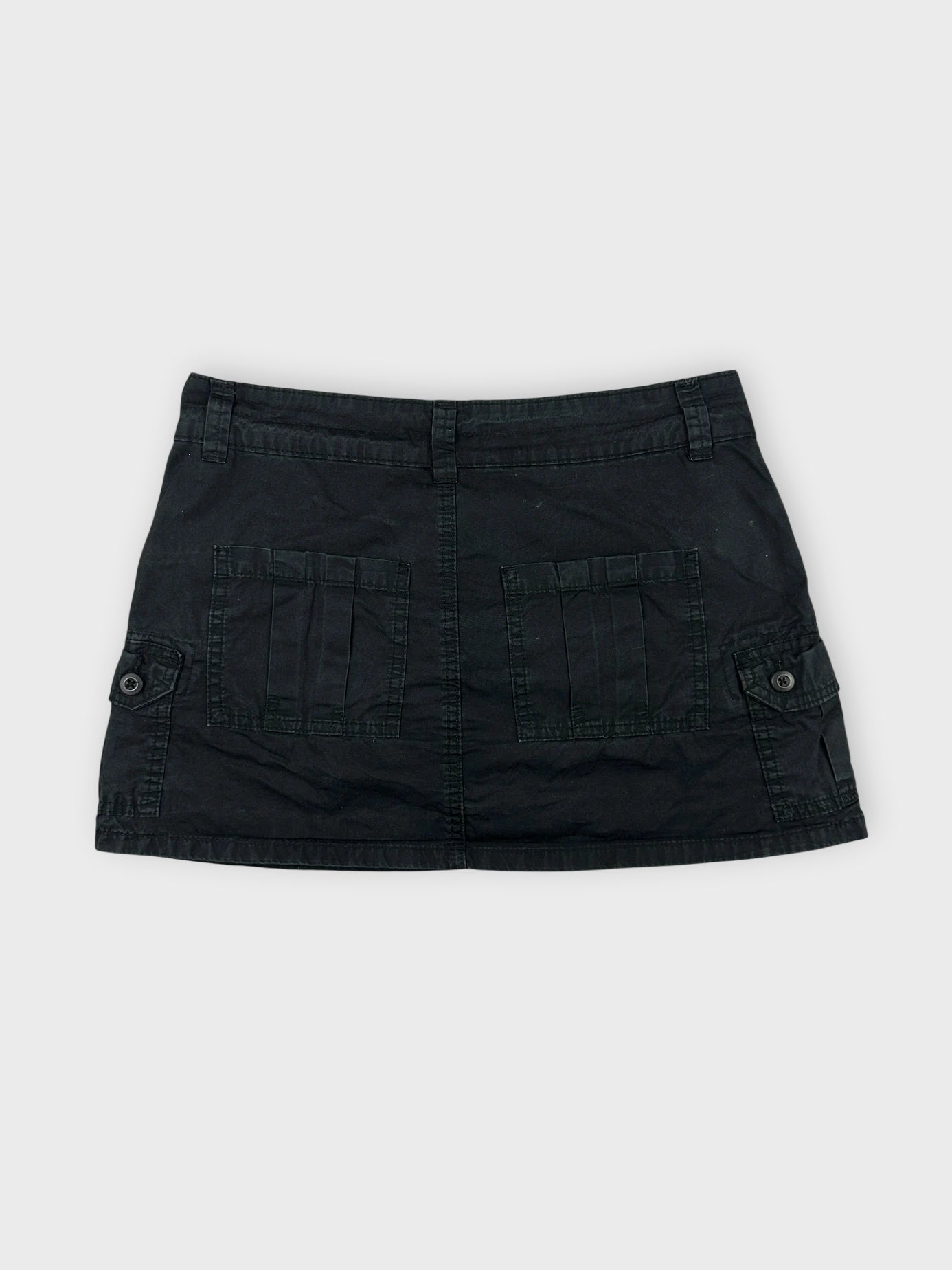 Casual black mini skirt back view featuring two large pockets.