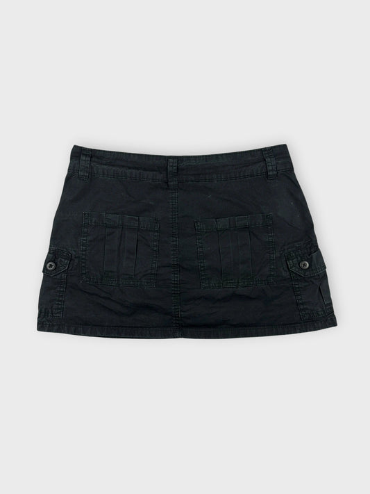 Casual black mini skirt back view featuring two large pockets.