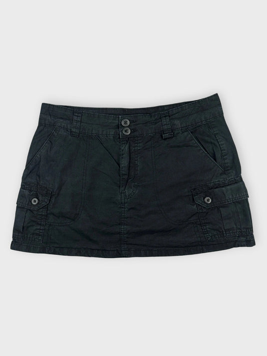 Casual black mini skirt with pockets front view featuring button details.