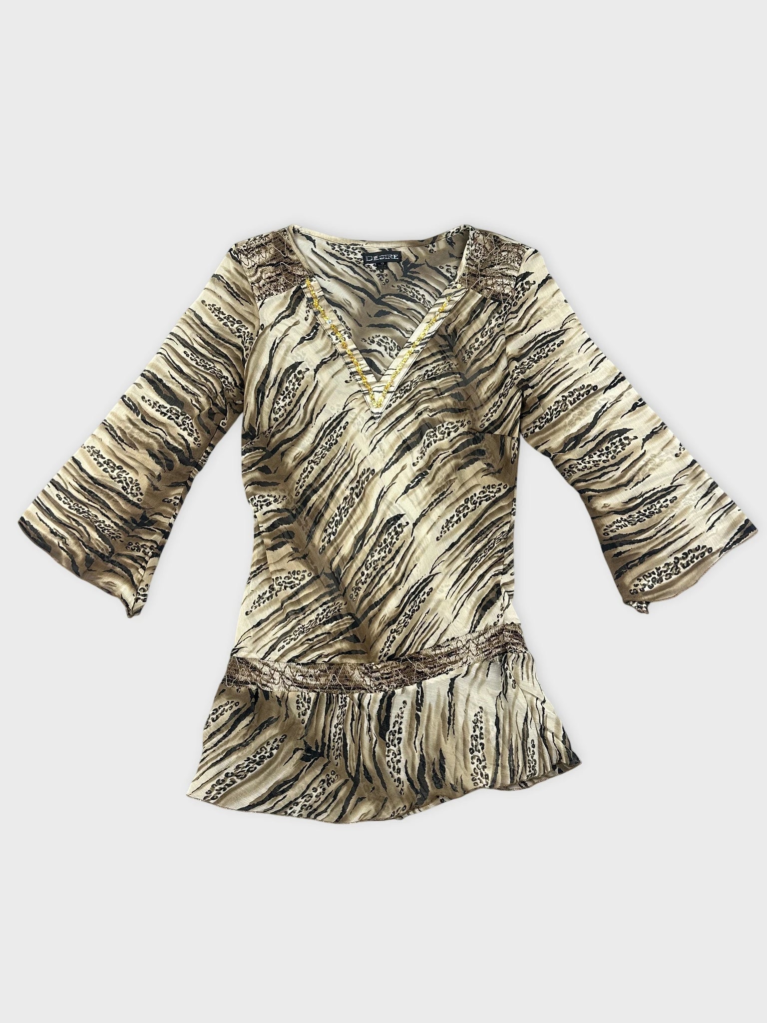 Chic animal print blouse with lace detail front view in beige and black.