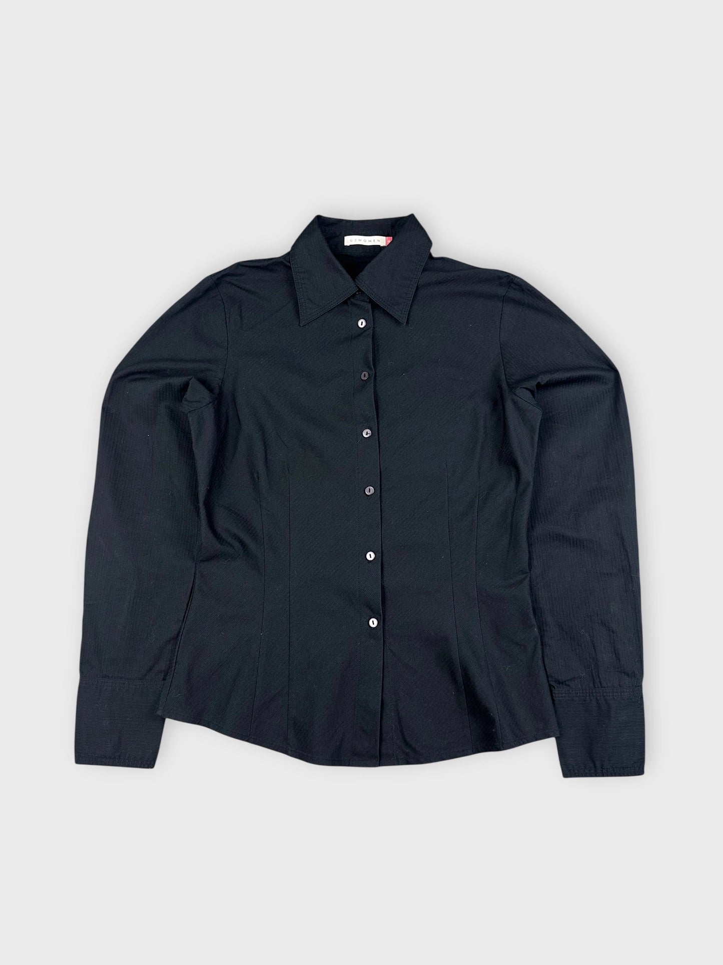 Black button-up shirt with a tailored fit detail view.