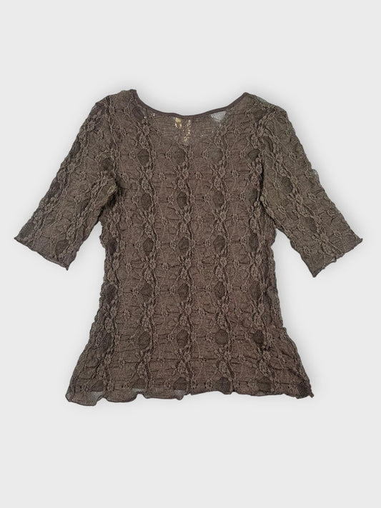 Chic black lace top back view featuring a detailed crochet pattern.