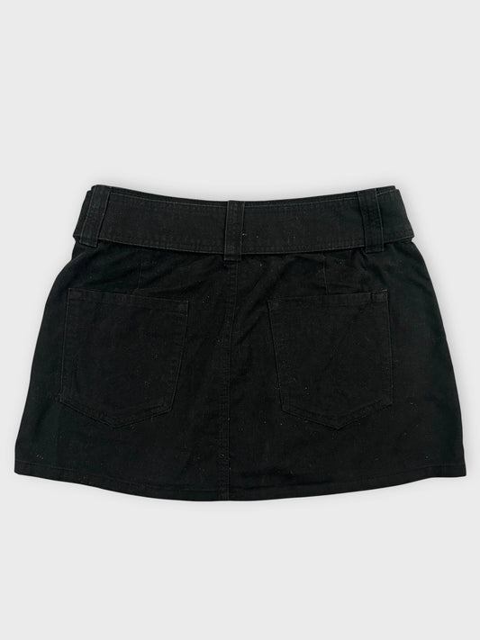 Back view of a black mini skirt with adjustable belt and pockets.