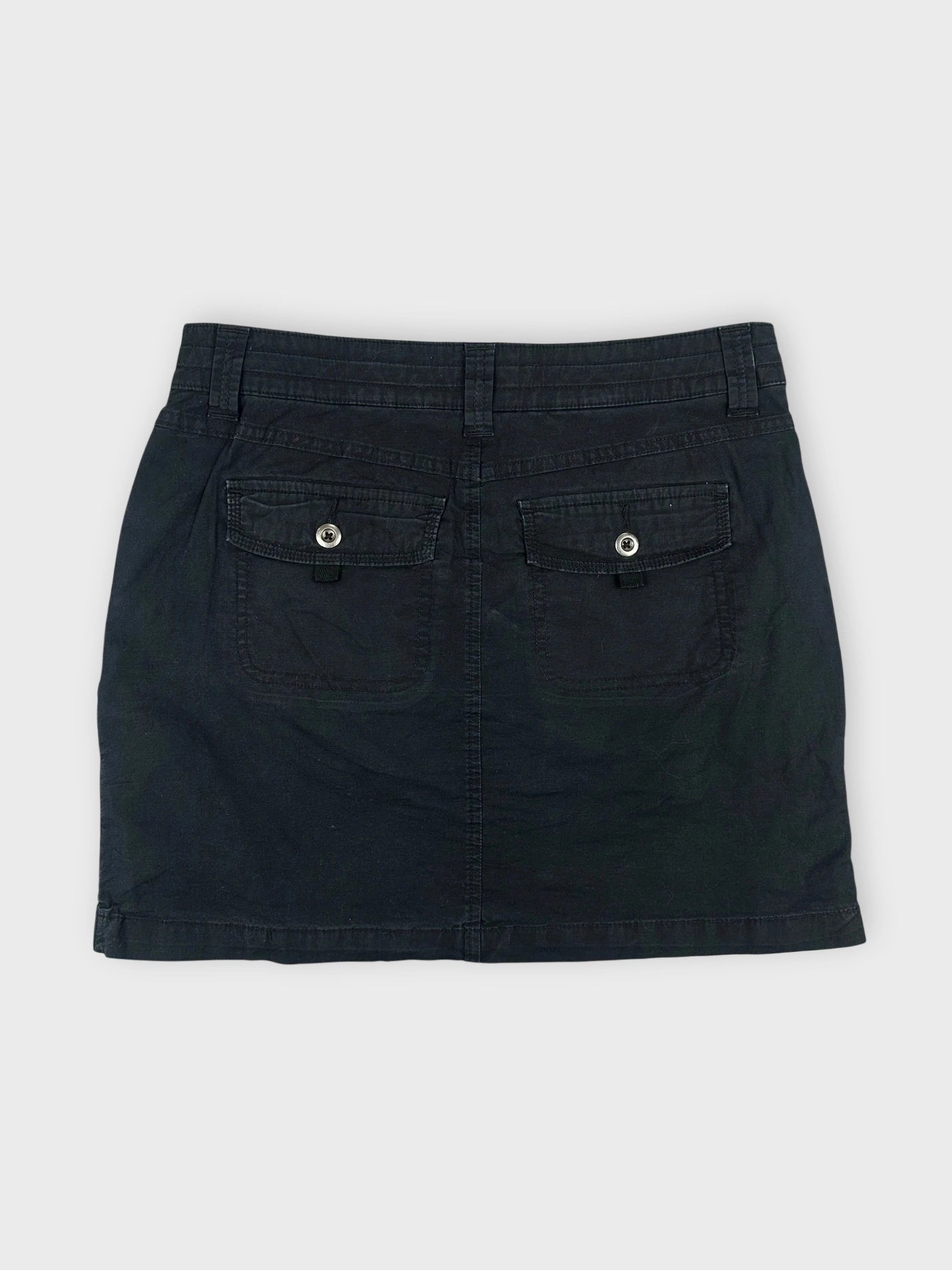 Chic black mini skirt with zipper detail back view