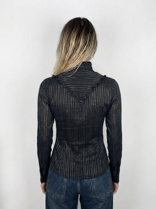 Back view of a black striped blouse featuring ruffled neckline detail.