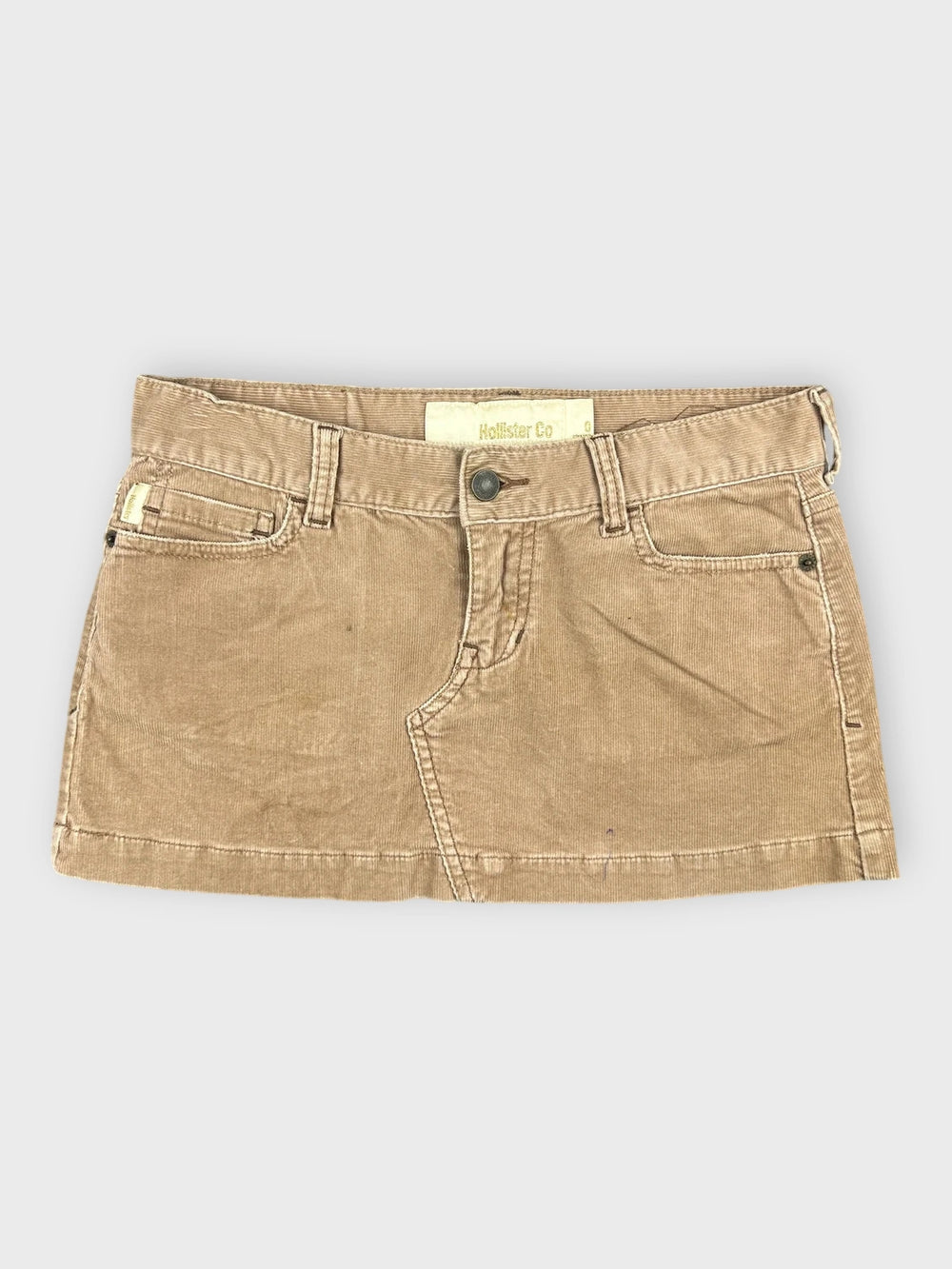 Chic brown denim mini skirt with side pockets front view