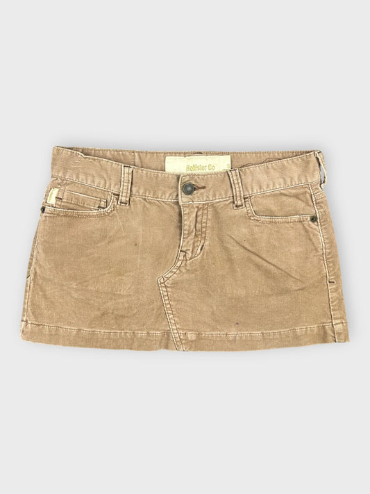Chic brown denim mini skirt with side pockets front view