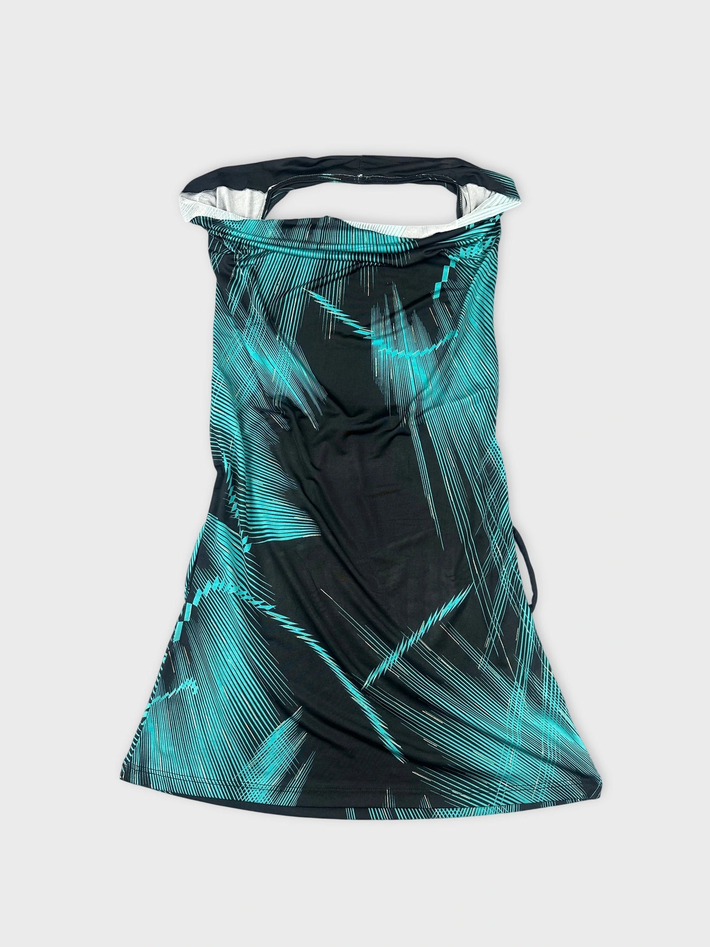 Front view of a black cowl neck top with turquoise edgy patterns.