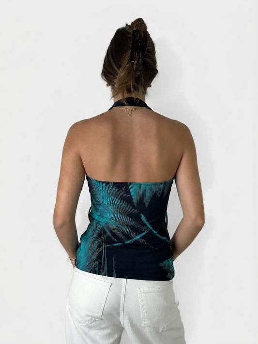 Back view of a cowl neck top in navy with edgy teal patterns.