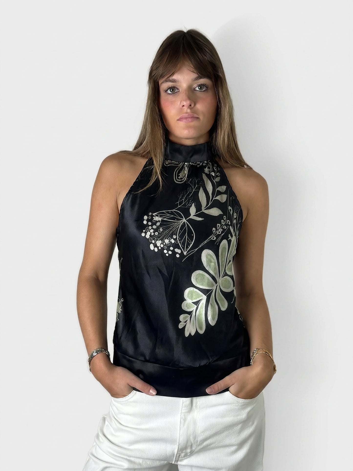 Chic floral satin halter top in black with a unique neckline, front view.