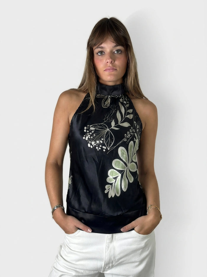 Chic floral satin halter top in black with a unique neckline, front view.
