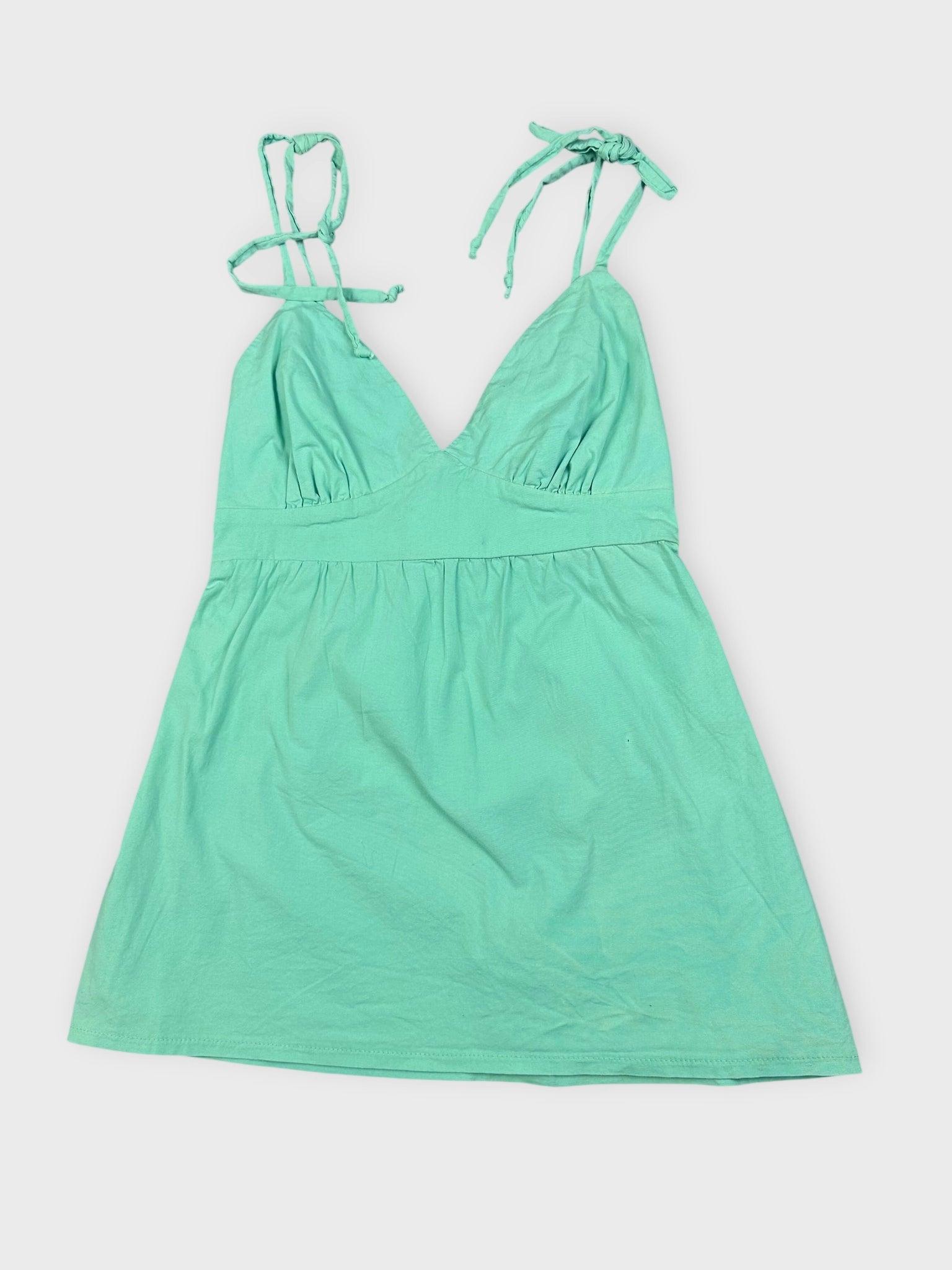 Mint green mini dress with adjustable straps front view