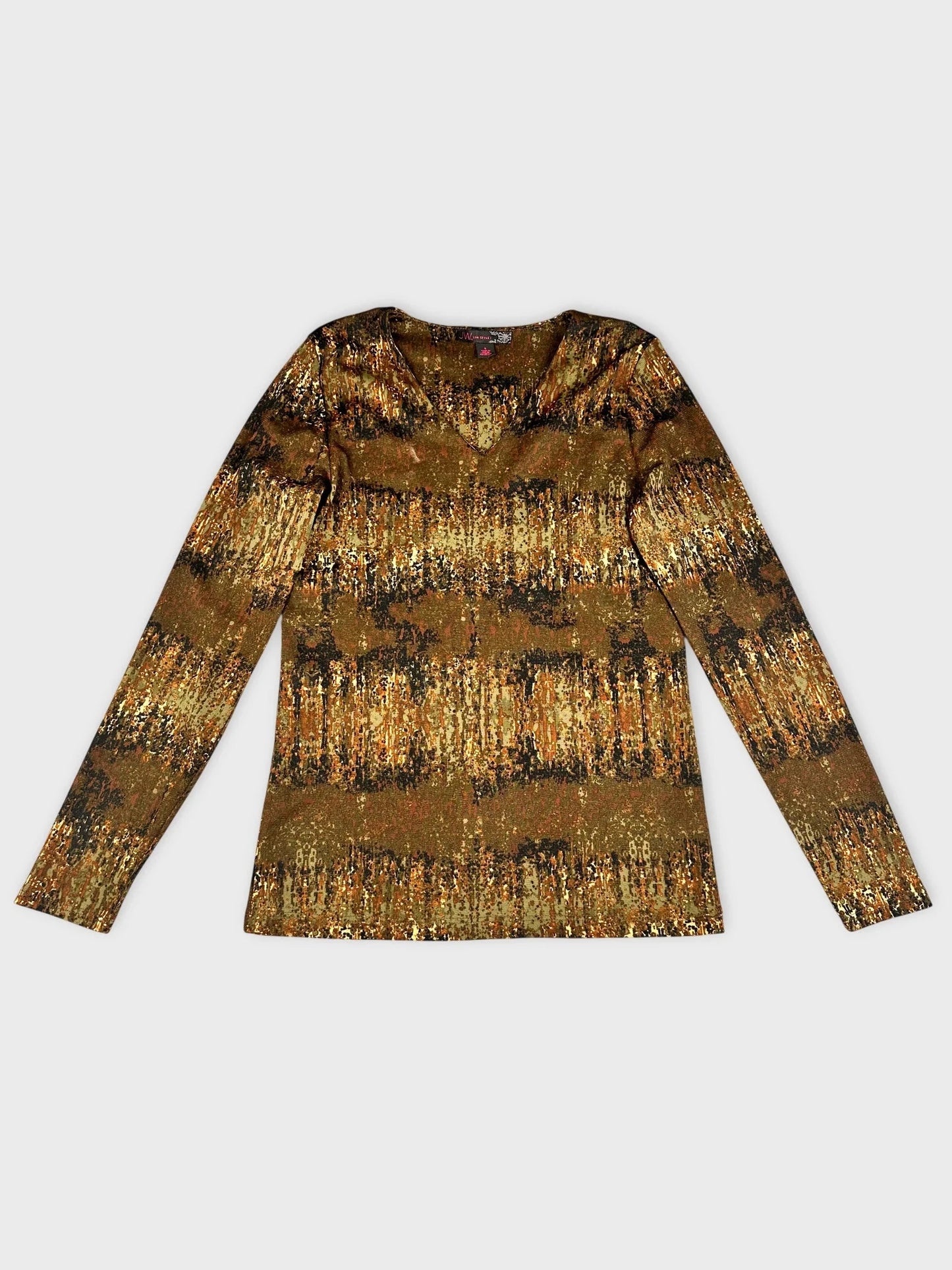 Back view of long sleeve V-neck top in earthy tones with nature-inspired print.