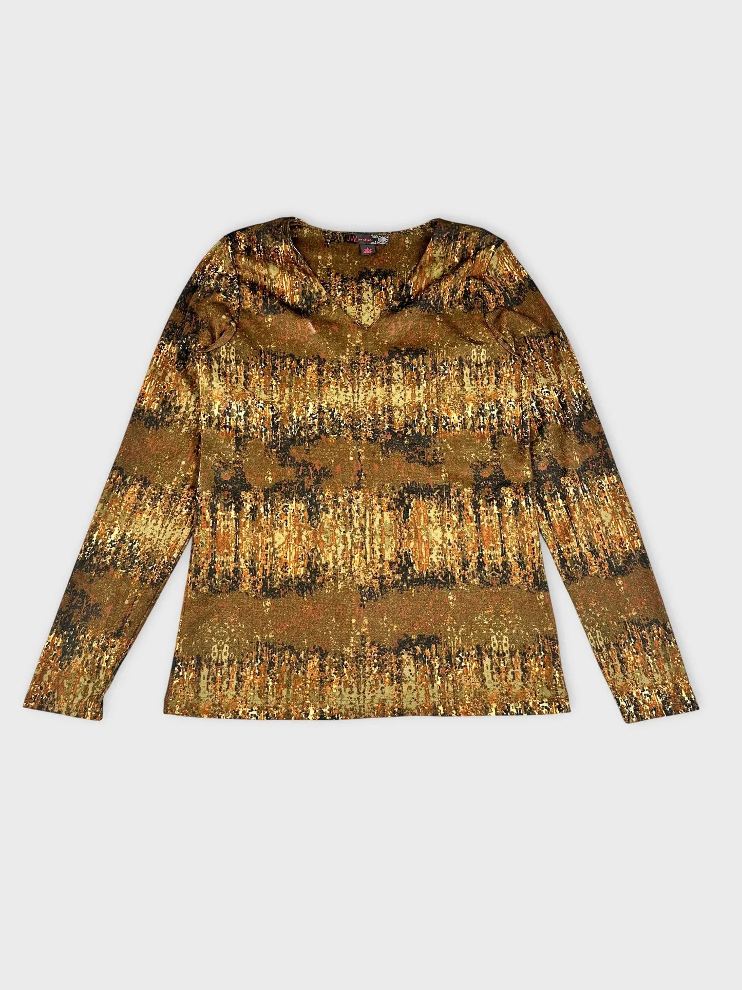 Front view of long sleeve top in earthy tones with nature-inspired print.