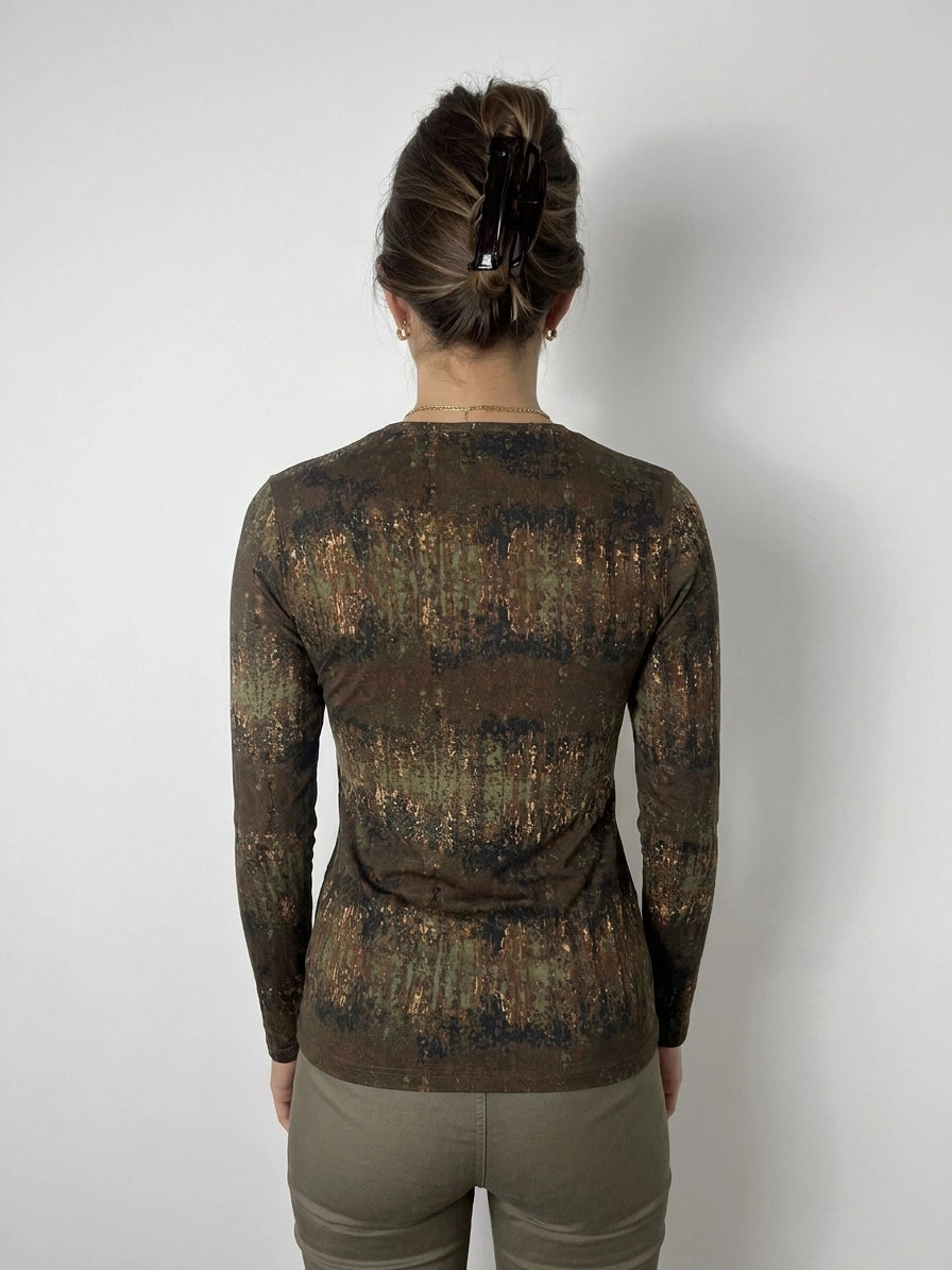 Back view of a long sleeve top in earthy tones with a textured pattern.