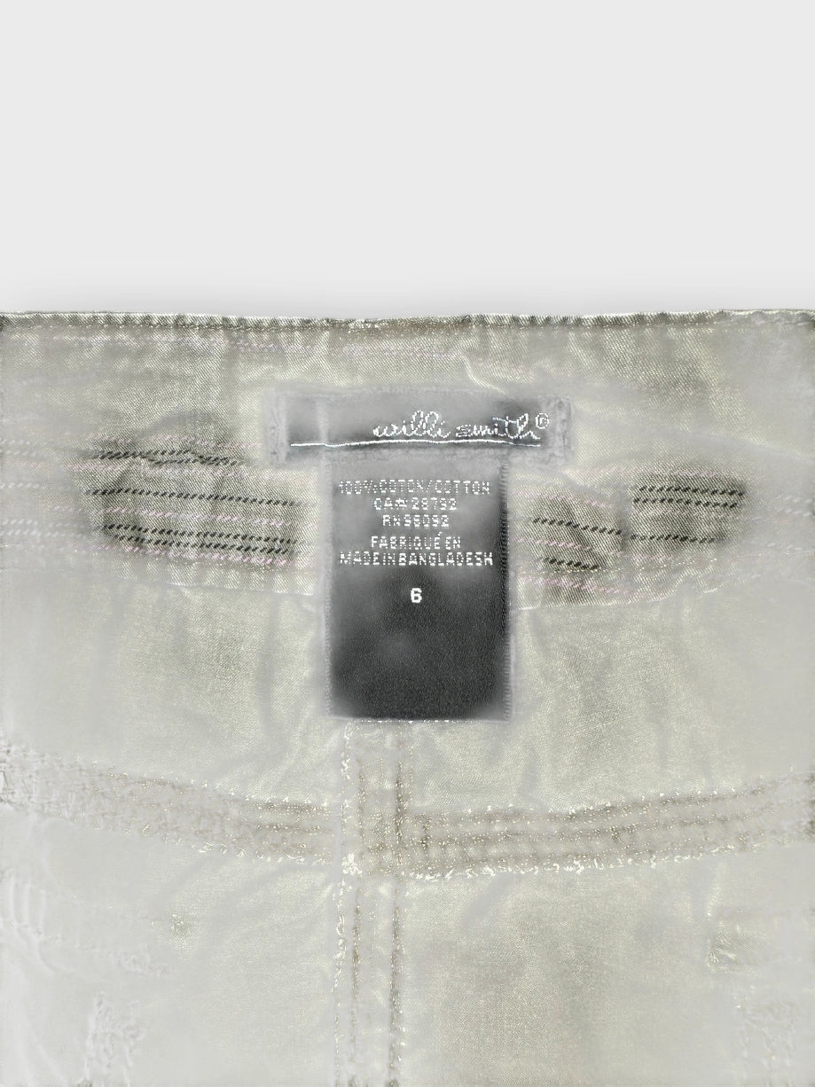 Olive mini skirt detail view showing smart pockets and stylish stitching.