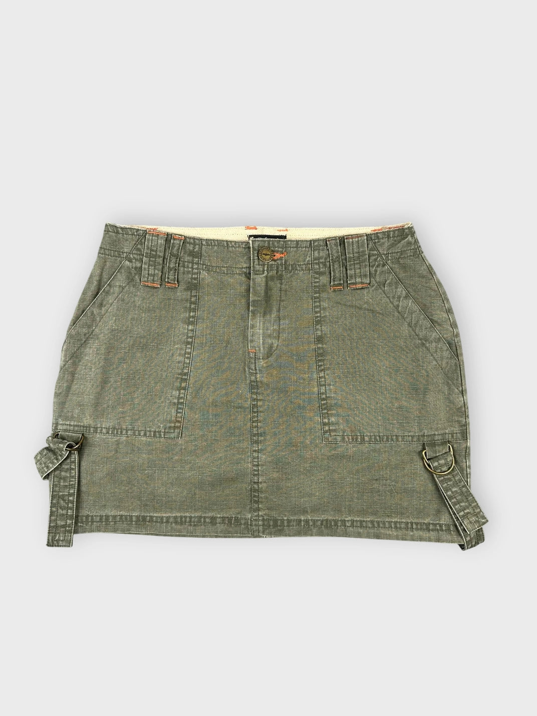 Chic olive mini skirt with unique side straps front view