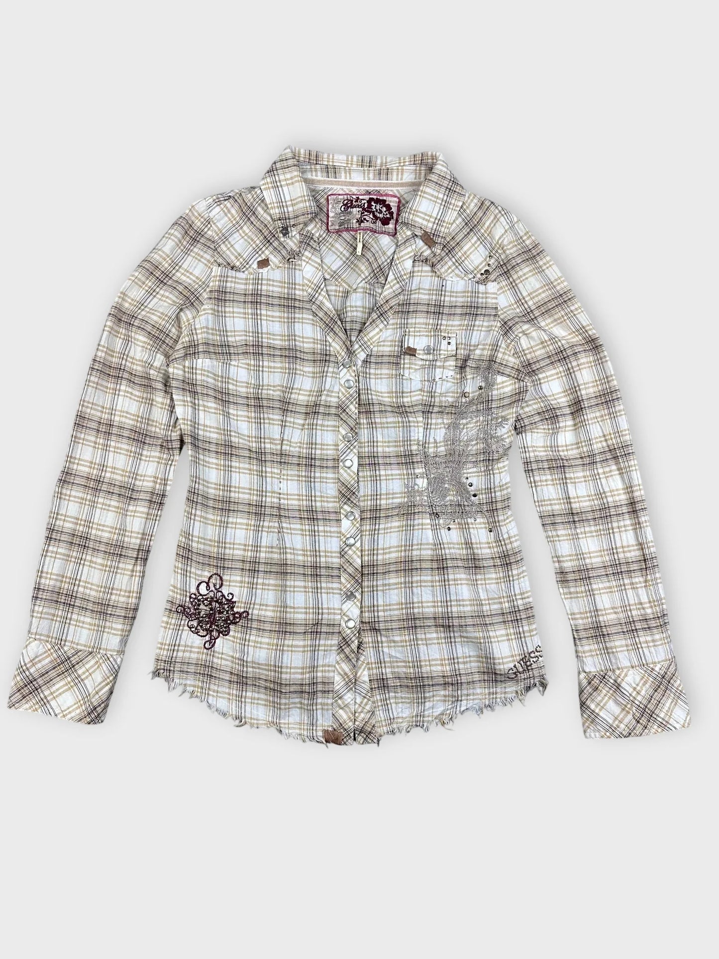 Front view of a plaid button-up shirt in beige and yellow with frayed hem.