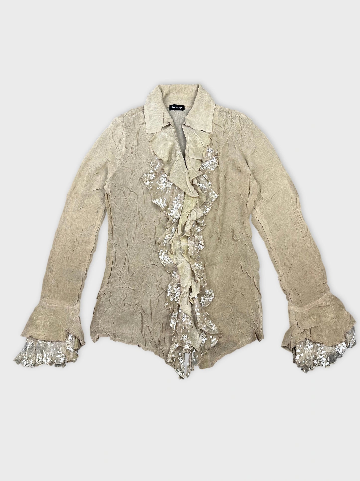 Beige ruffled long sleeve top with decorative sleeves front view