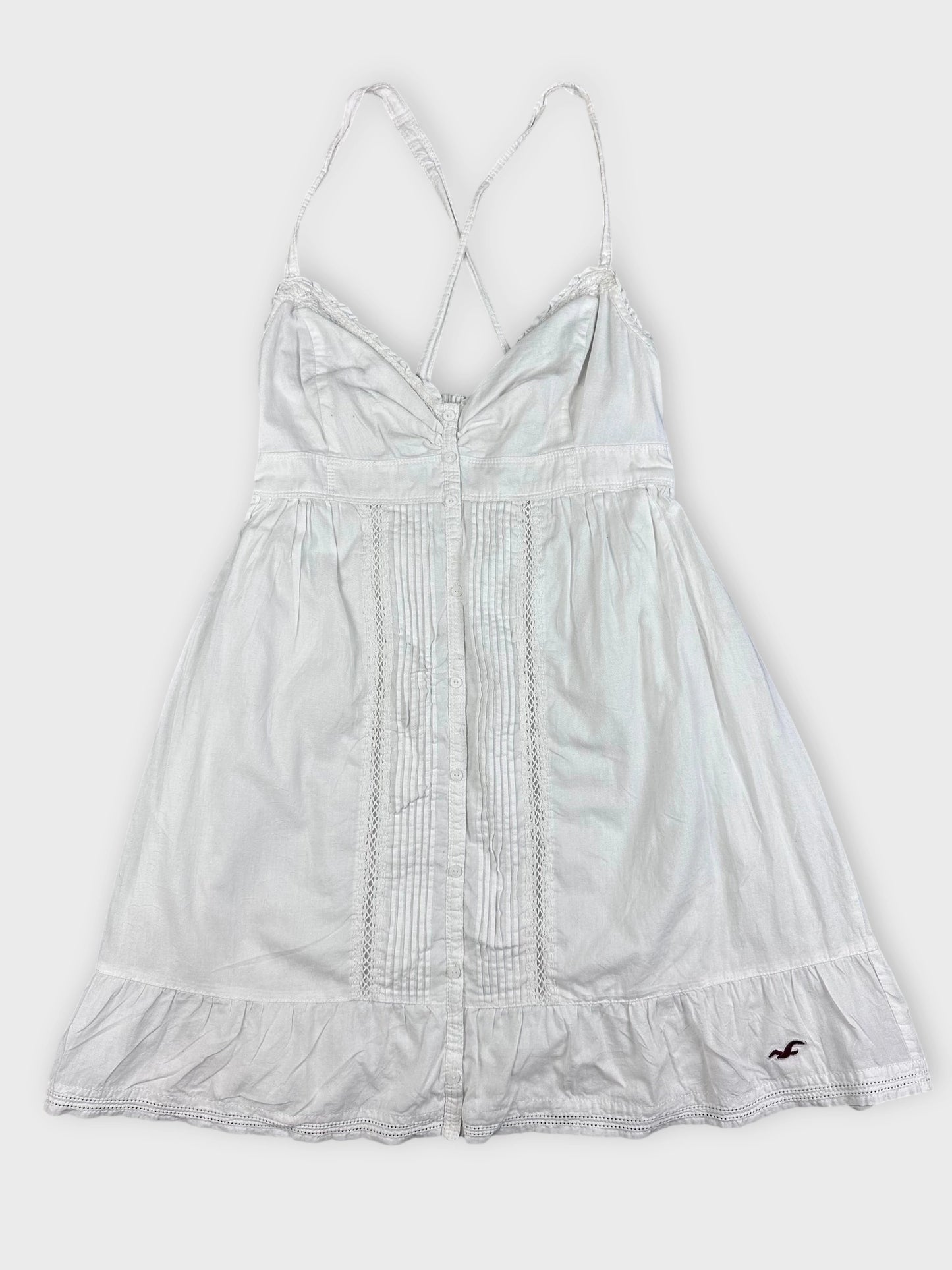 Chic white cotton strap dress with decorative button detail front view