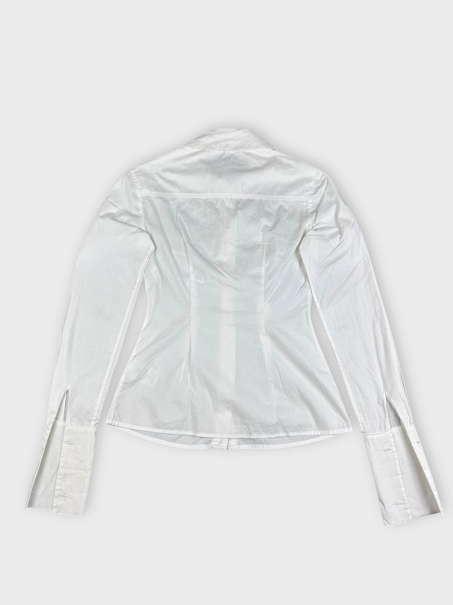 Back view of a white long sleeve button up shirt showing detailed cuffs.