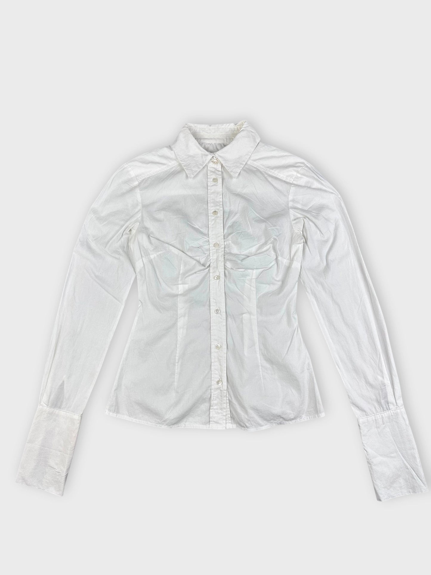 detail view of a white long sleeve button up shirt with a classic collar