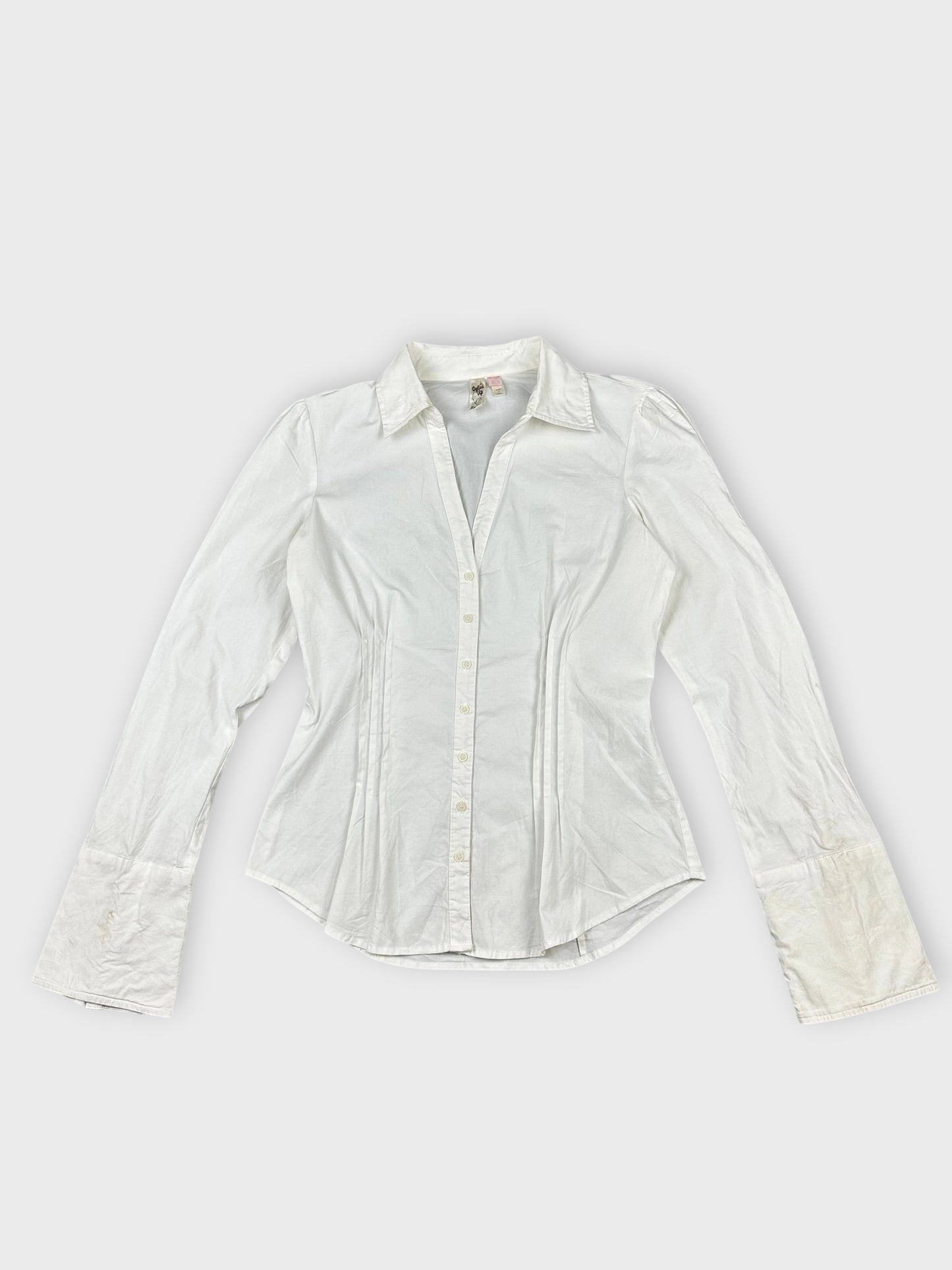 Chic white long sleeve button-up shirt front view with classic collar and flared sleeves.