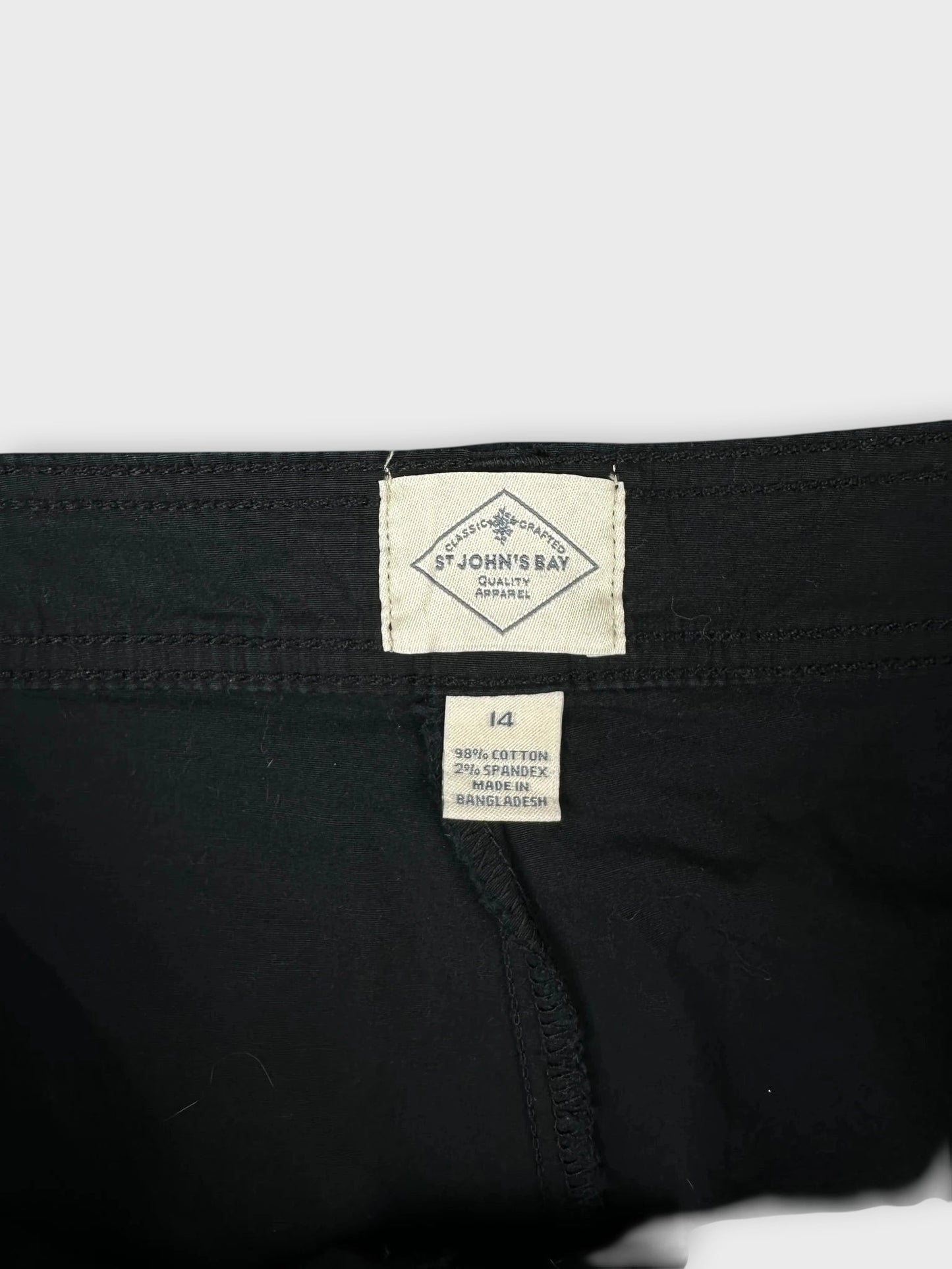 Classic black mini cargo shorts with label detail view