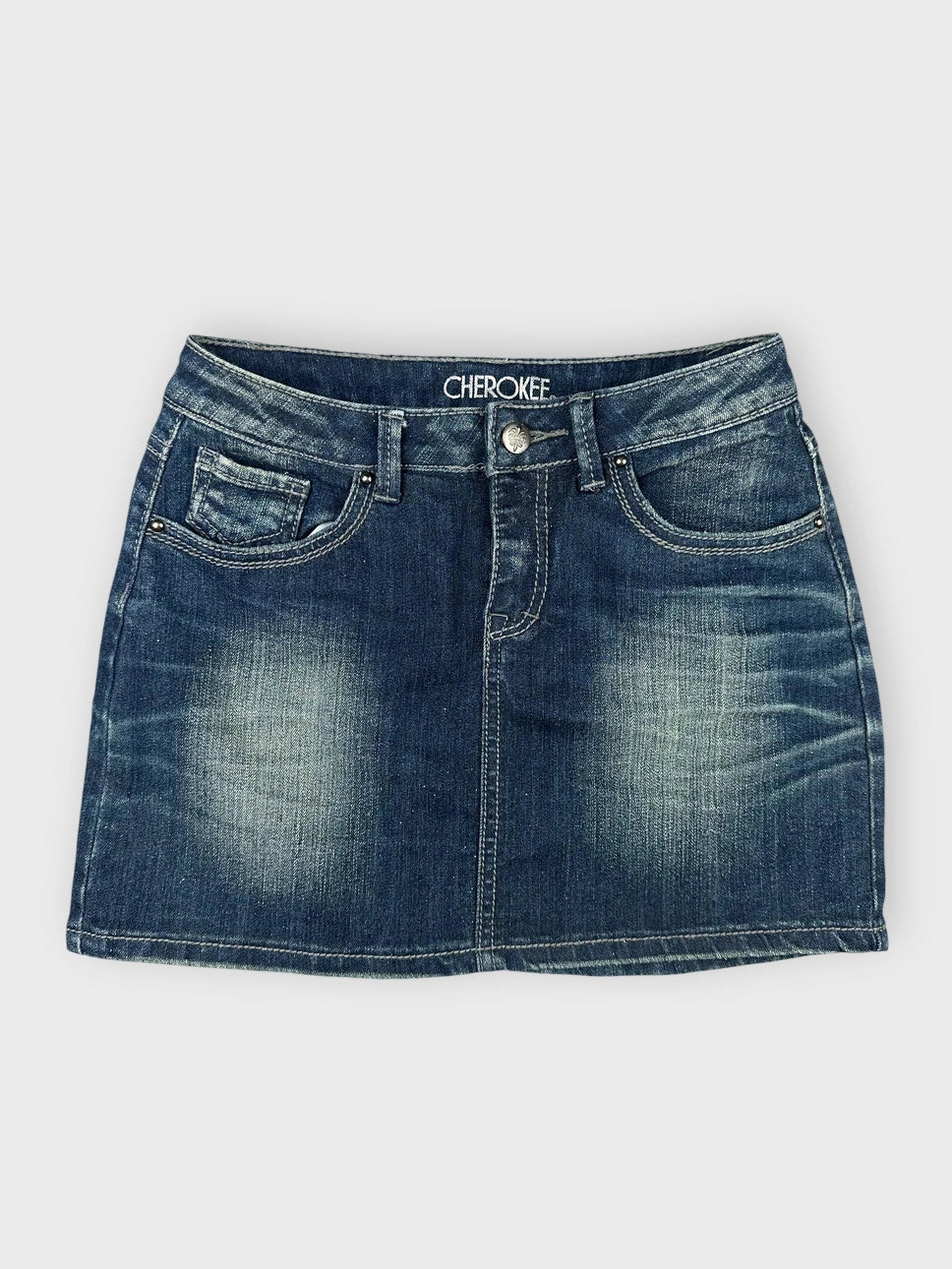 Classic denim mini skirt in faded blue front view with subtle wash details.
