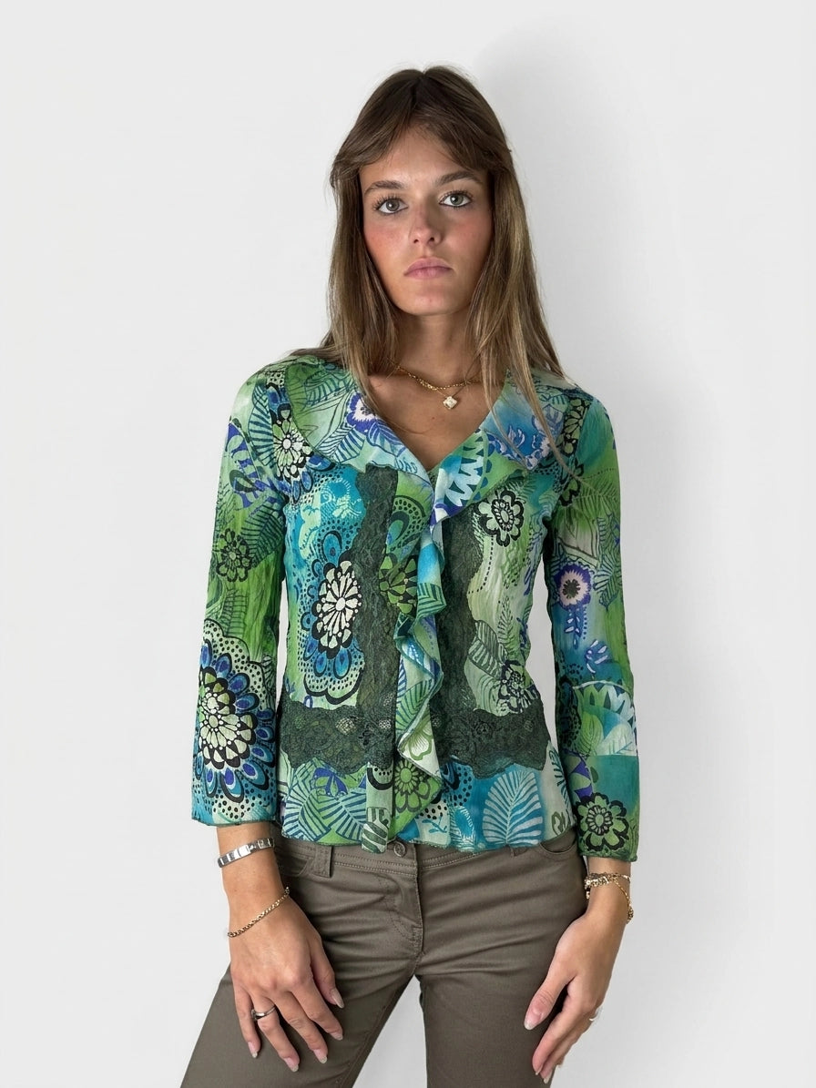 Colorful floral print blouse with ruffles, visible in front view.