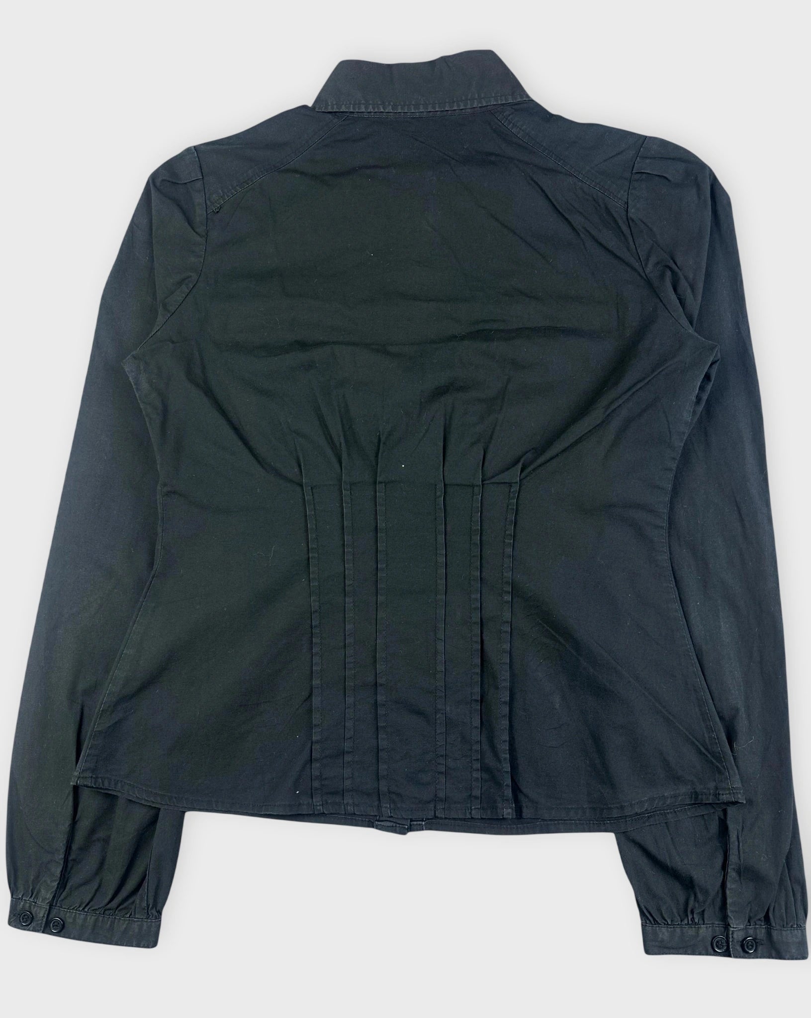 Back view of a black ruched button-up shirt with gathered detail.