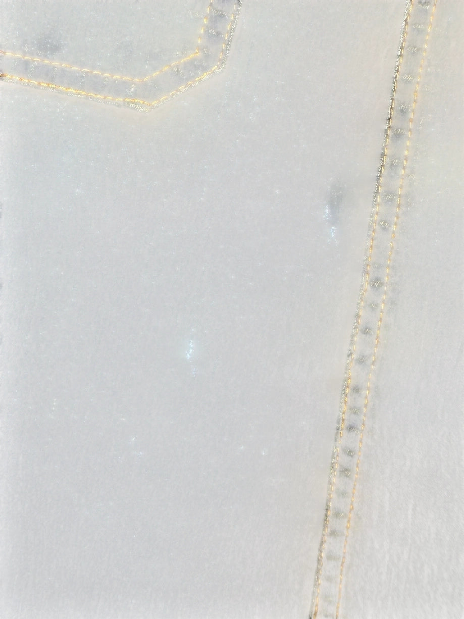 Detail view of a denim mini skirt featuring yellow stitching and a belted detail.
