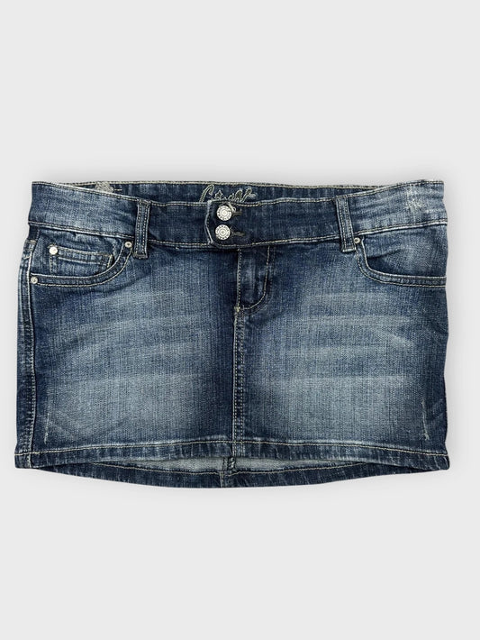 Front view of blue denim mini skirt featuring button details.