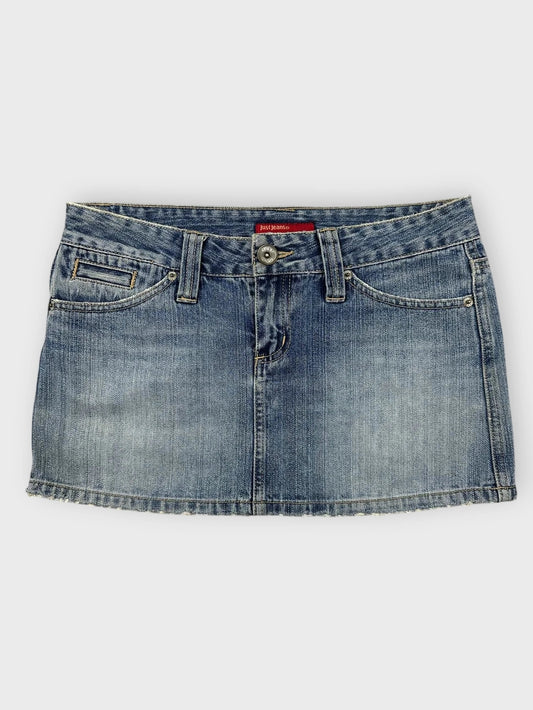 Denim mini skirt in light blue with distressed hem front view