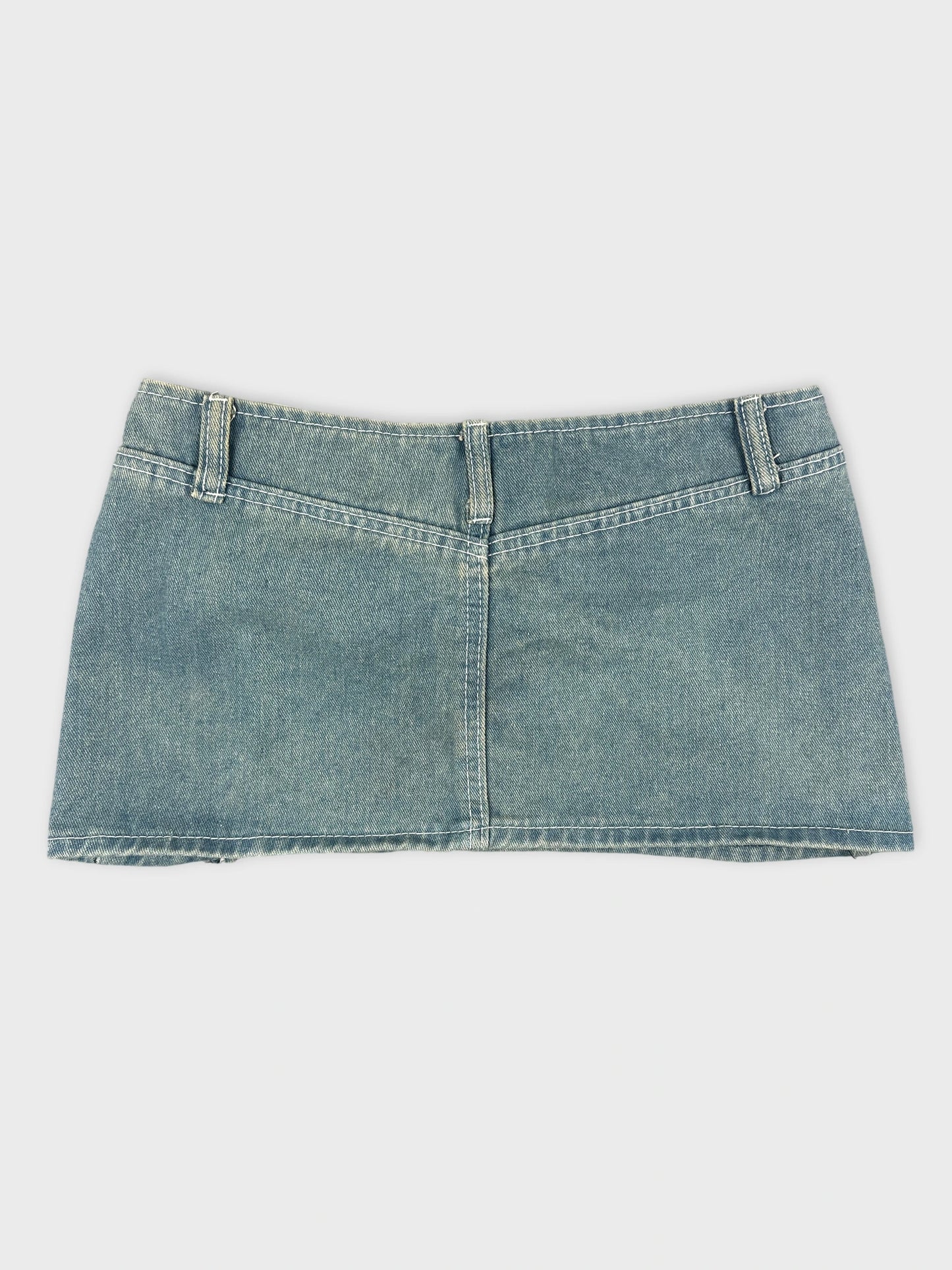 Denim mini skirt in light blue back view with a statement buckle detail.