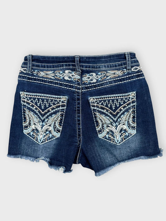 Distressed denim mini shorts in dark blue with intricate back pocket embroidery back view
