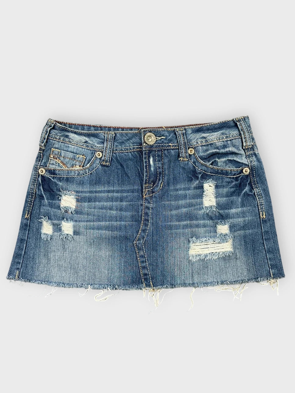 Distressed denim mini skirt with raw hem front view
