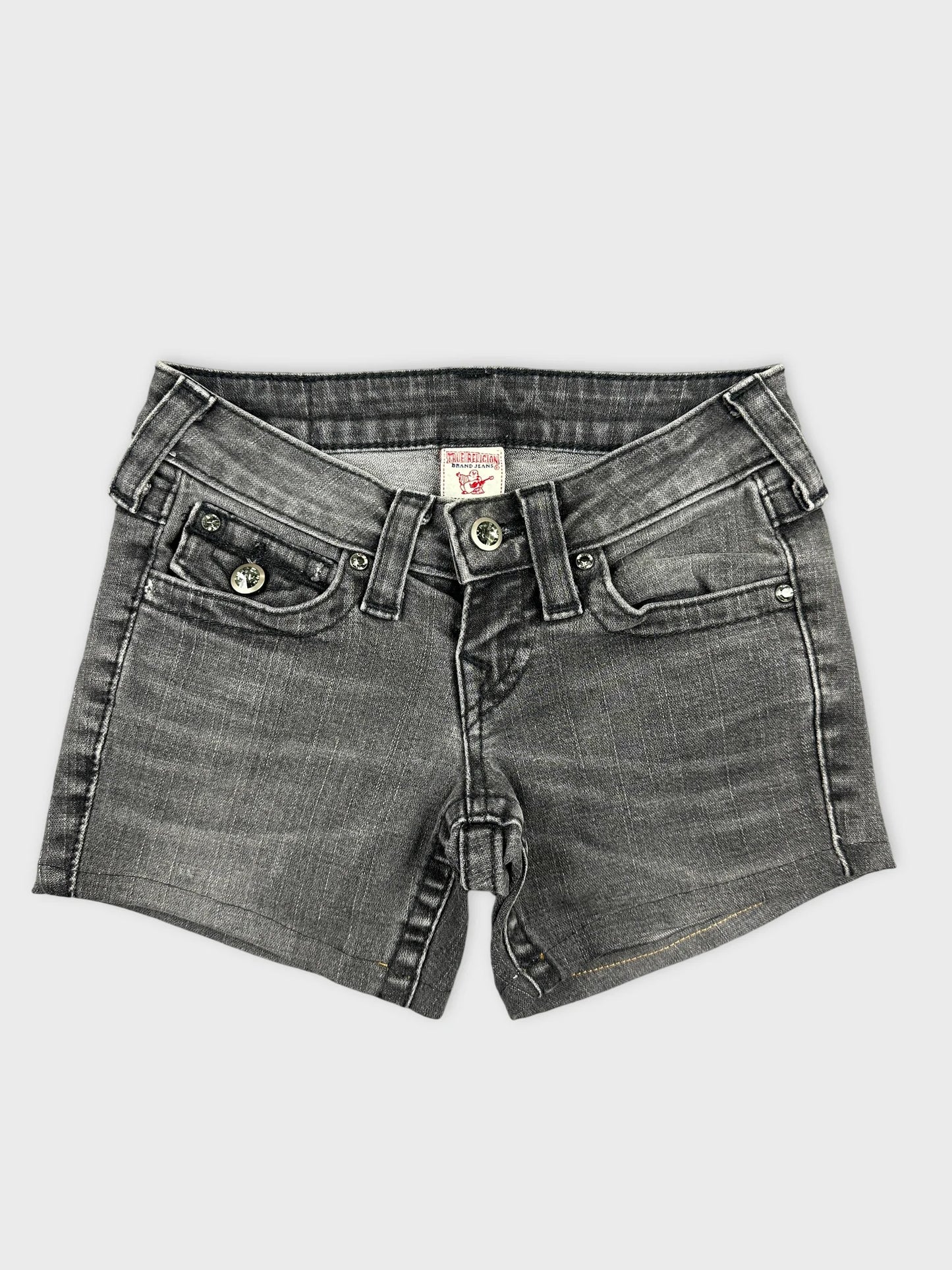 Front view of edgy black denim shorts featuring unique details and subtle wash.