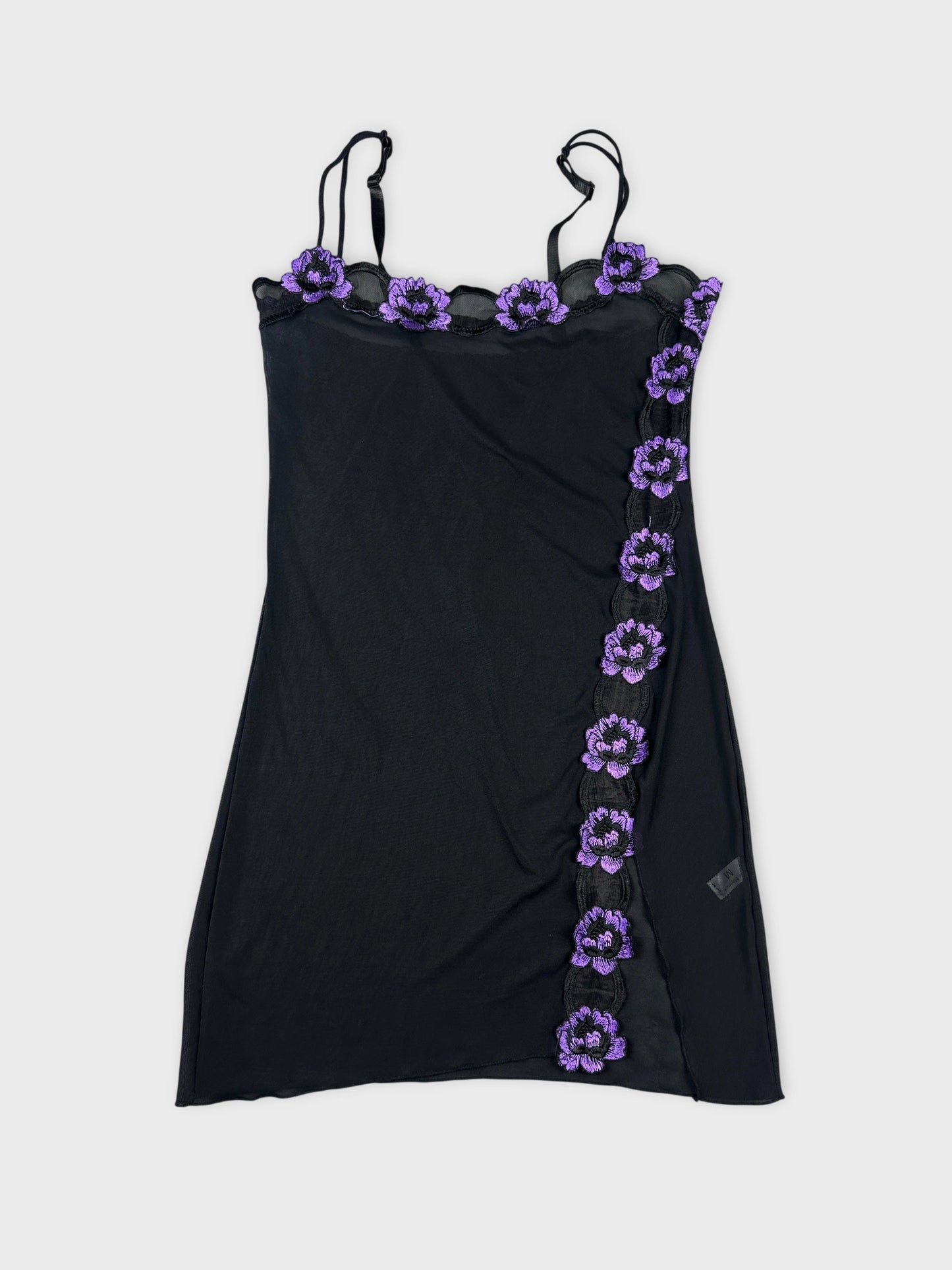 Front view of a black mesh tank top with purple floral trim.