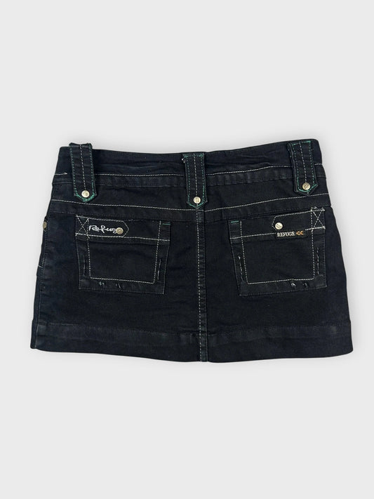 Back view of an edgy black mini skirt with pockets and visible stitching.