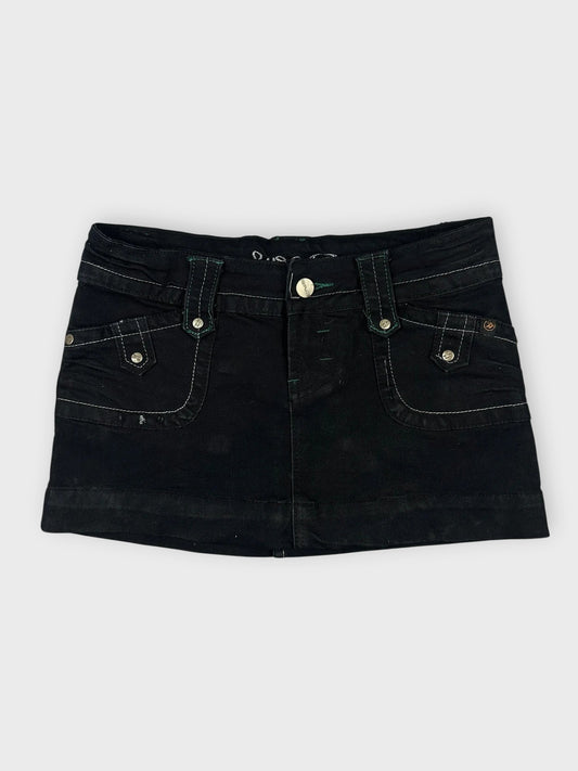 Edgy black mini skirt with pockets front view featuring a slim waistband.