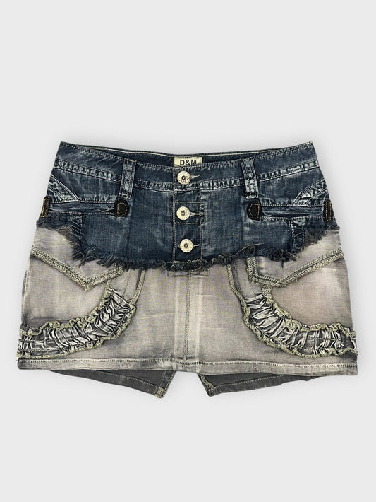 Edgy denim mini skirt with ruffles in gray front view.