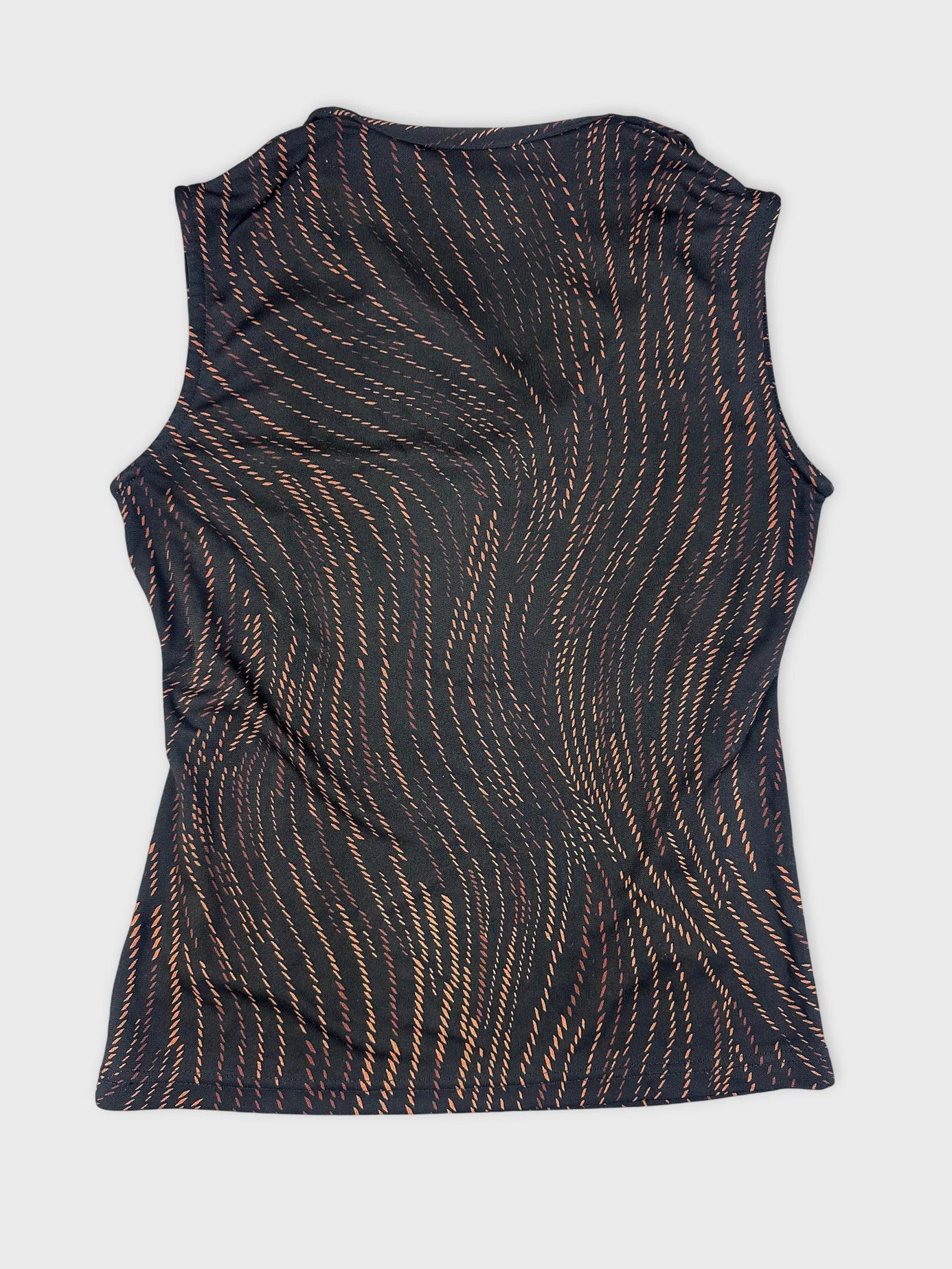 Detail view of a black cowl neck top with swirling orange pattern.