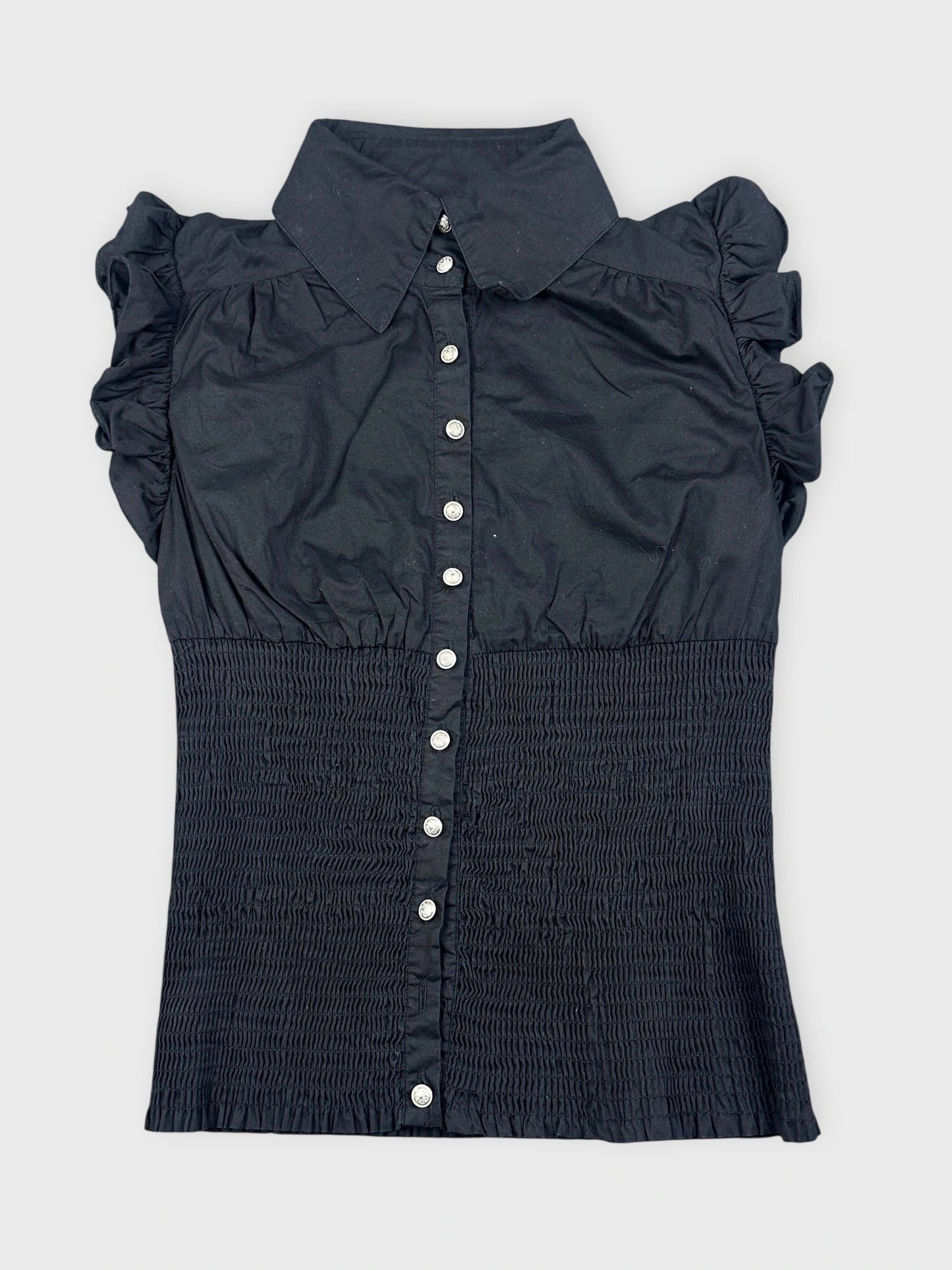 Black ruffled blouse featuring button closure in front view.