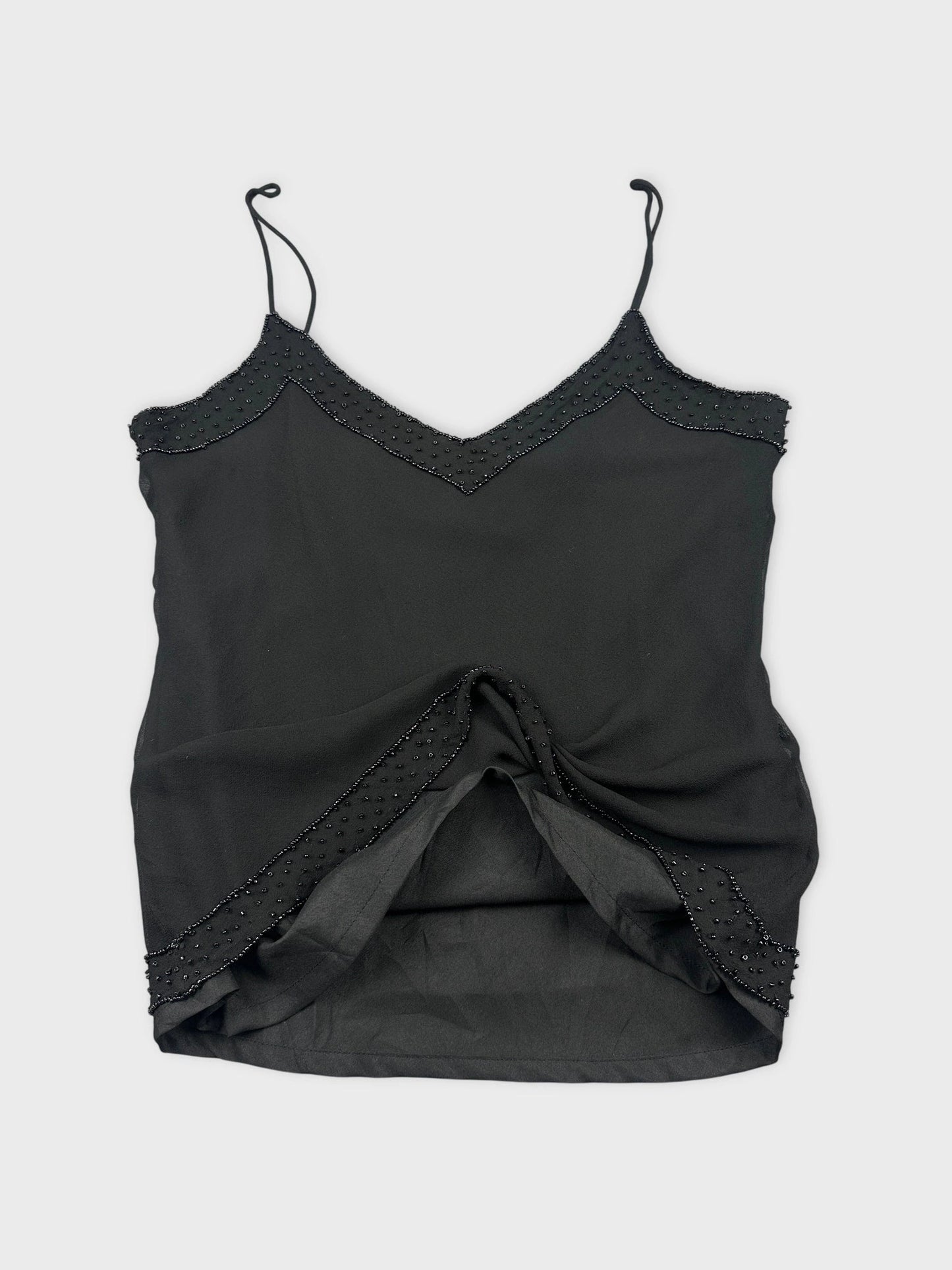 Elegant black silk camisole with lace trim detail view.