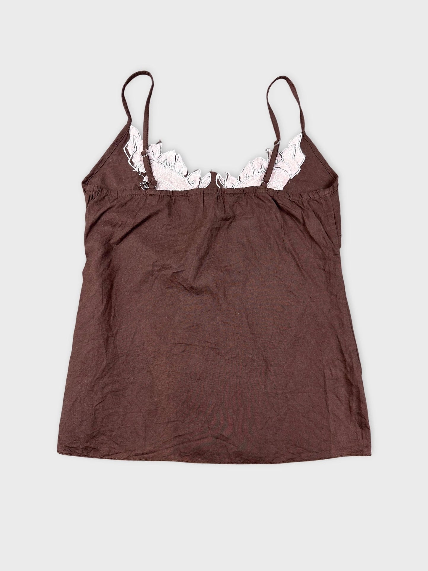 Back view of a brown cami top with embroidered lace trim.