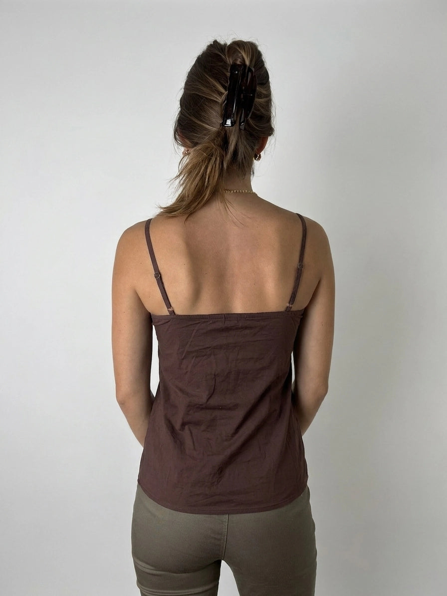 Back view of a brown cami top featuring embroidered details.