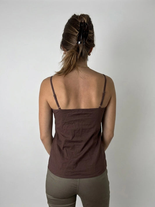 Back view of a brown cami top featuring embroidered details.